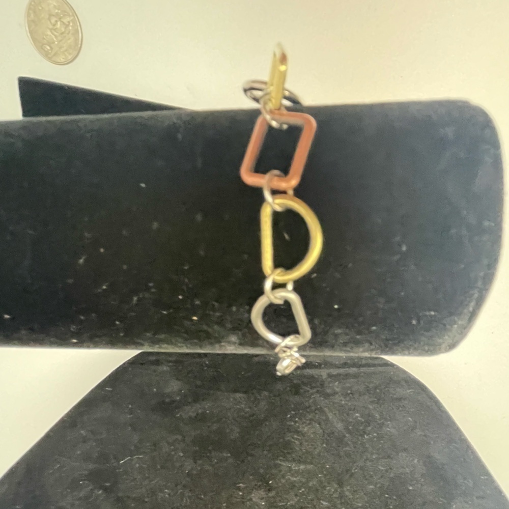Tri-tone Geometric Bracelet in gold, silver, and copper tones.